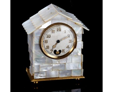 A small early 20th century French mother-of-pearl architectural house clock, engine turned silvered dial with Arabic numerals
