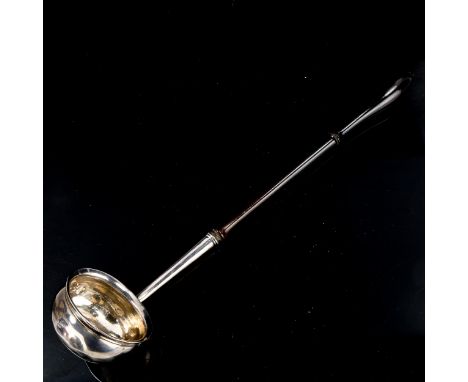 A George II silver toddy ladle, with turned ebony handle and owner's initials on base, by Ralph Maidman, hallmarks London 173