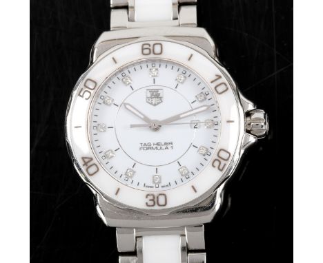 TAG HEUER - a lady's stainless steel and white ceramic Formula 1 quartz bracelet watch, ref. WAH1315, white dial with diamond