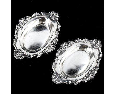 MAPPIN & WEBB - a pair of George V cast-silver pin dishes, with cast floral and foliate rims, hallmarks London 1919, length 1