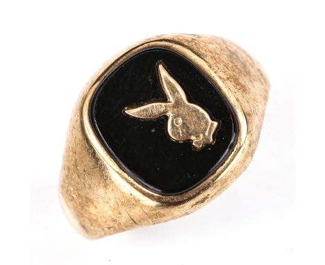 A late 20th century 9ct gold black onyx Playboy bunny signet ring, hallmarks London 1986, setting height 14.6mm, size R, 3.2g