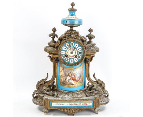 A French brass and porcelain 8-day mantel clock, in Louis XVI style, white enamel dial with Roman numeral hour markers and ha