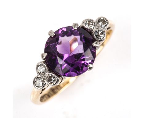 A 9ct gold amethyst and diamond dress ring, platinum tops set with round-cut amethysts and single-cut diamond trio shoulders,