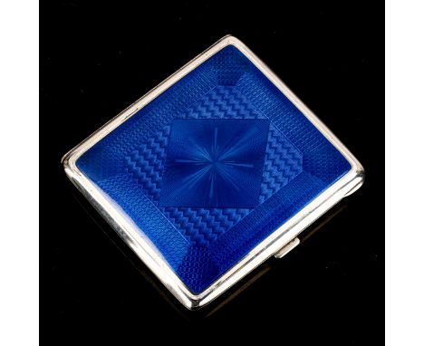 An Art Deco Continental sterling silver and blue enamel cigarette case, engine turned decoration with gilt interior, maker's 