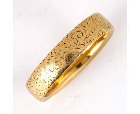 A heavy Victorian 18ct gold wedding band ring, engraved foliate decoration, maker's marks GB, hallmarks London 1890, band wid