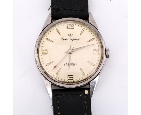 SMITHS - a Vintage stainless steel Imperial mechanical wristwatch, silvered dial with gilt quarterly Arabic numerals and swee