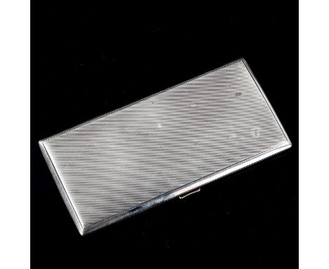 A large George VI Art Deco silver cigarette case, rectangular form with allover engine turned decoration and gilt interior, b