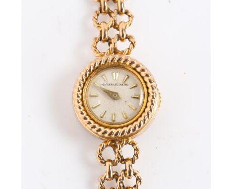 JAEGER LECOULTRE - a lady's Vintage 9ct gold mechanical wristwatch, silvered dial with gilt arrowhead hour markers, rope twis