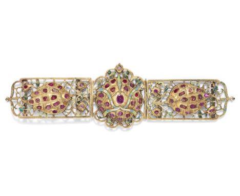 An Ottoman ruby-set and enamelled gold belt buckle Turkey, 17th Centurycomprising a central rose surrounded by openwork tendr