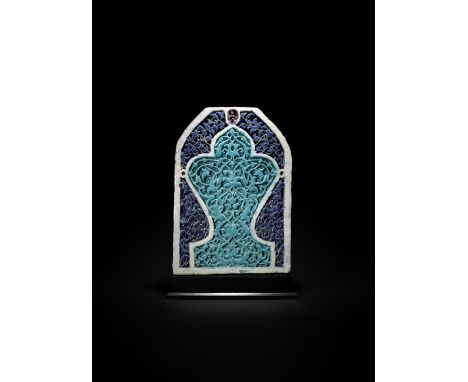 A Timurid moulded pottery mihrab tile Central Asia, second half of the 14th Centuryin the form of a mihrab, decorated in coba