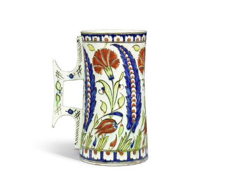 A Cantagalli Iznik style pottery tankard Italy, 19th Centuryof waisted cylindrical form with angular handle, decorated in cob