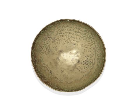 An Ayyubid brass magic bowl or 'poison cup' Egypt or Syria, 13th/ 14th Centuryof shallow rounded form engraved to the interio