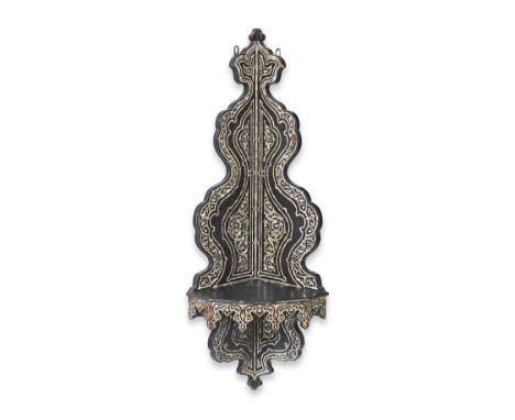 A Damascus mother-of-pearl-inlaid wood corner bracket  Syria, 19th Centuryof lobed form surmounted by a palmette motif, the p
