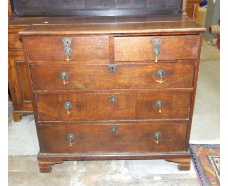 An antique oak chest of two short and three long drawers, on bracket feet, 99cm wide, 90cm high. 