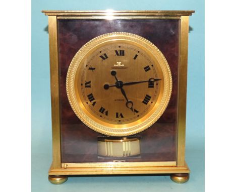 A Jaeger LeCoultre Elysee Atmos clock, the dial with Roman numerals, set in a gilt metal beaded bezel, four-sided brass case 