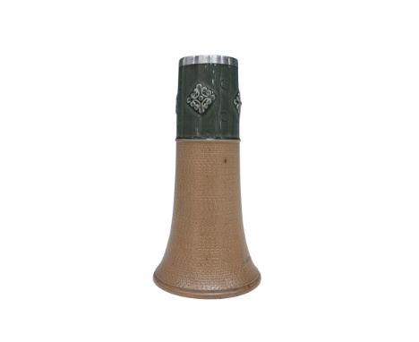 This stoneware vase has a green glazed band on top adorned with geometric medallions and impressed button designs. The rest o
