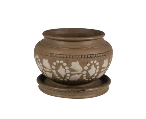 A brown planter showcases elegant abstract white art accents, seamlessly joined by a smooth, rounded base. Marked Doulton Lam