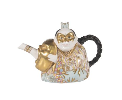 Bone china covered figural cafe pot, depicted as an oriental man hugging a golden mask. The long braided hair of the man form
