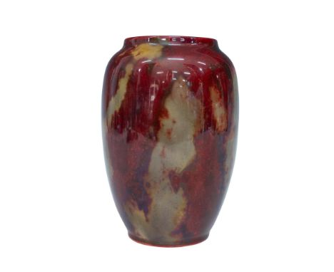 Beautifully mottled small vase in ruby red and beige with a wide opening at the top. Royal Doulton Flambe backstamp. Artist: 