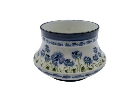 A small bowl-shaped vase decorated with blue blossomed poppies. Macintyre J M &amp; Co. Burslem England backstamps. Artist: W