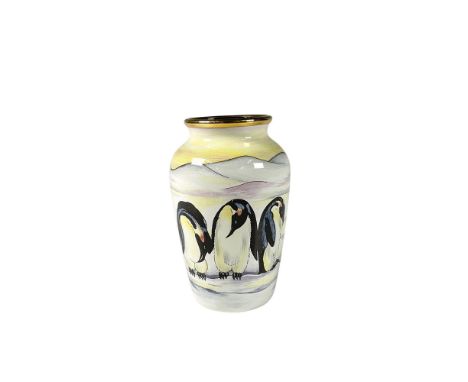Adorable small table vase adorned with penguin family in a beautiful yellow background with a gilt edge. Moorcroft backstamp.