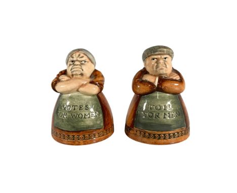 This charming pair of seasoning shakers features a man D7067 and a woman D7066, both dressed in brown outfits and wearing gre