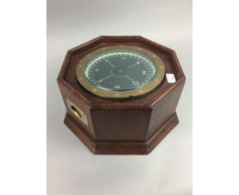SHIPS COMPASS, mounted in an octagonal case, 33cm wide