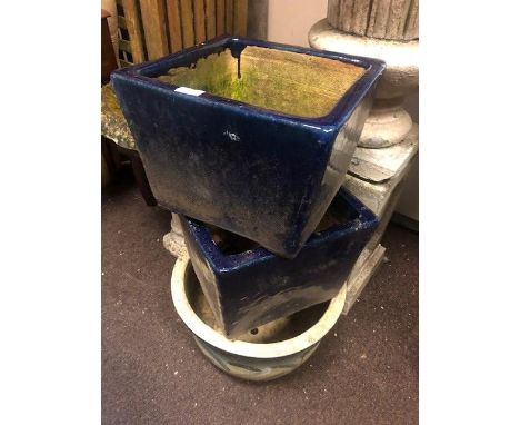 STONEWARE CIRCULAR PLANTER, 47cm diameter, along with a pair of square planters, 36cm wide