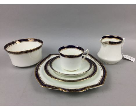 BLUE AND GILT DECORATED PART TEA SERVICE, comprising 9 cups, 10 saucers, 12 sideplates, cream, sugar and two sandwich plates