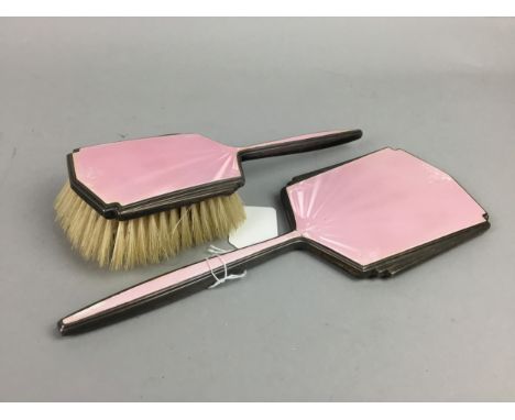 ART DECO SILVER AND PINK GUILLOCHE ENAMEL VANITY MIRROR AND BRUSH, the mirror 29cm long, along with a Kienzle eight day mante