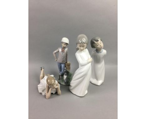 NAO FIGURE OF A GIRL, 25cm high, along with three other Nao figures of a ballerina, a boy with a dog and another of a boy (4)
