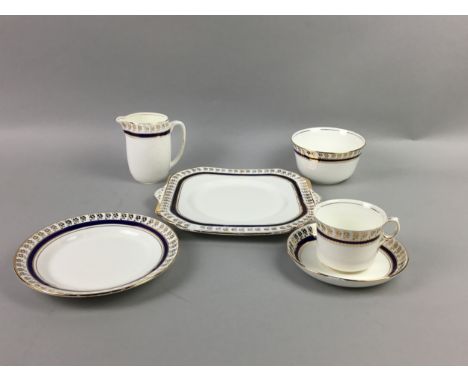 GLADSTONE CHINA TEA SERVICE, with blue and gilt decoration, comprising 12 trios, two creams, two sugars and two sandwich plat