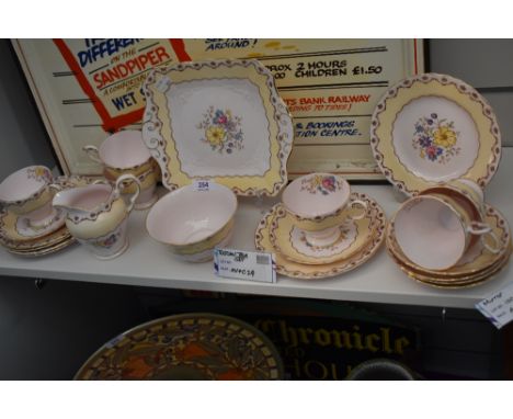 An art deco design part tea service by Tuscan china having floral and gilt pattern