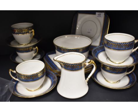 A collection of art deco Salisbury china including cups and saucers, sugar basin,jug and more having white ground with blue c