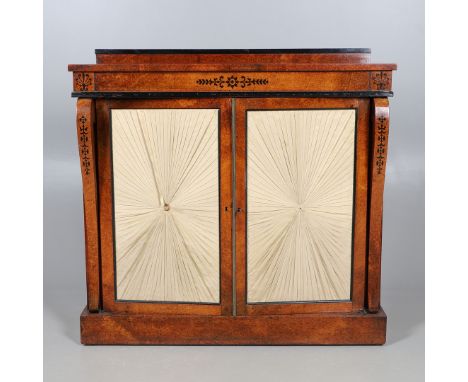 A REGENCY EBONY INLAID AMBOYNA CHIFFONIER. with scrolled mounts and Neo-Classical foliate inlay, the double doors with pleate