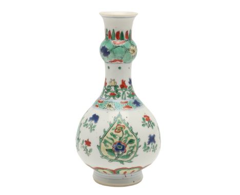 CHINESE FAMILLE VERTE BOTTLE VASE. In the Kangxi style but probably later, the bottle vase with a garlic shaped neck, painted