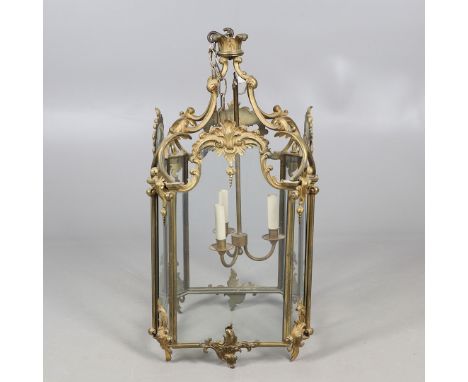 A LARGE FRENCH GILT METAL HALL LANTERN, OF LOUIS XV STYLE, CIRCA 1900. of octagonal form, the glass panels to a cast foliate 