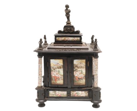 AN AUSTRIAN ENAMEL AND GILT METAL MOUNTED EBONISED MINIATURE TABLE CABINET. 19th century, square stepped top surmounted by mi