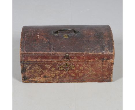 A GEORGE III LEATHER COVERED DOCUMENTS TRAVEL TRUNK. embossed  with gilt crowns and foliate scroll decoration, the domed lid 