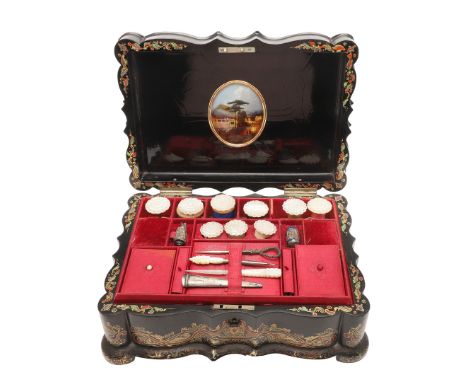 A 19TH CENTURY EBONISED PAPER MACHE SEWING BOX AND CONTENTS. the hinged lid inset with painted mother of pearl panel illustra