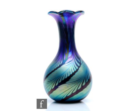 A late 20th Century Okra glass vase of globe and shaft form with a wave rim, the body decorated with a tonal blue and purple 