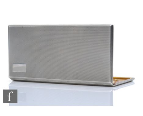 A hallmarked silver rectangular, slide action cigarette case, weight 11oz, length 18cm, with engine turned decoration to whol
