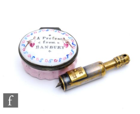 A 19th Century Bilston oval enamel patch box titled 'A Present from Banbury', A/F, and a French cigar piercer in the form of 