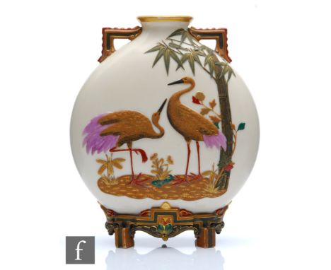 A late 19th Century Royal Worcester Aesthetic twin handled moon flask decorated in relief with two exotic birds stood beside 