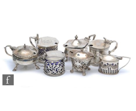 Seven assorted hallmarked silver mustard pots to include drum, pierced and oval examples, total weight 17.5oz (excluding line