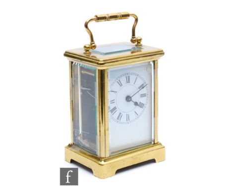 A late 19th to early 20th Century French brass carriage clock, white enamelled dial, on plinth base, height 10cm. 