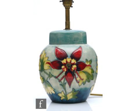 A Moorcroft table lamp of ginger jar form decorated in the Columbine pattern, complete with Moorcroft shade, impressed marks,