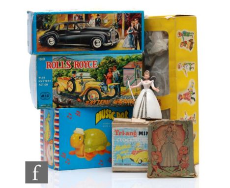 A collection of assorted vintage toys, comprising Welsotoys Fairy Queen, Triang Minic Clockwork Mother and Pram, Pelham Puppe