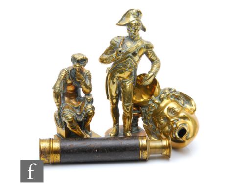 A 19th Century figure of a sailor wearing a bicorn and hat smoking a pipe near a globe, height 19cm, another of a gladiator i