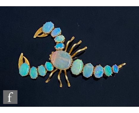 A modern 9ct opal brooch modelled as a scorpion, with fourteen individually claw set stones, weight 3.5g, length 5cm, unmarke